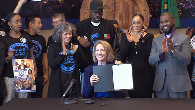 City Council resolution endorsing I-940 signed by Mayor Durkan